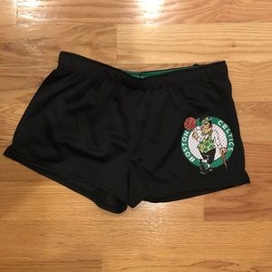 Shorts with Boston Celtics emblem on left leg.